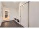 Mud room features tile floors, a bench, storage, and sliding closet doors at 10698 W 26Th Ave, Lakewood, CO 80215