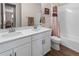 Bathroom featuring double vanity with a bathtub and shower at 4121 River Oaks St, Castle Rock, CO 80104