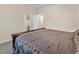 Neutral bedroom features a closet, white trim, and door leading to another room at 4121 River Oaks St, Castle Rock, CO 80104