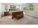 Bright bedroom with large windows, carpet flooring and classic wood bedroom set at 4121 River Oaks St, Castle Rock, CO 80104