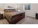Cozy bedroom with a queen-sized bed and a neutral color scheme, perfect for relaxation at 4121 River Oaks St, Castle Rock, CO 80104