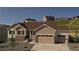 Beautiful, two-car garage home featuring stone accents, stylish curb appeal, and a well-maintained landscape at 4121 River Oaks St, Castle Rock, CO 80104
