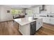 Bright kitchen with a center island, stainless steel appliances, and a view of the outdoor scenery at 4121 River Oaks St, Castle Rock, CO 80104