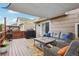 Back deck with a pergola cover, grill, outdoor seating, and privacy fencing at 12753 Buckhorn Creek St, Parker, CO 80134