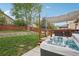 Large backyard with a deck and a hot tub at 12753 Buckhorn Creek St, Parker, CO 80134