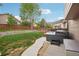 This backyard features a new hot tub, a retaining wall with a spacious lawn and wooden fence for privacy at 12753 Buckhorn Creek St, Parker, CO 80134
