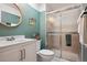 Neat bathroom featuring a vanity and tiled shower with glass doors at 12753 Buckhorn Creek St, Parker, CO 80134