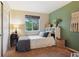 Cozy bedroom with a comfortable bed, closet, and view from the window at 12753 Buckhorn Creek St, Parker, CO 80134