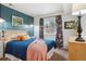 Bright bedroom featuring a window and neutral decor, providing a cozy space at 12753 Buckhorn Creek St, Parker, CO 80134