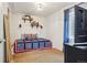Bedroom featuring a window, decor, and a dresser with a television at 12753 Buckhorn Creek St, Parker, CO 80134