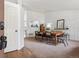Bright dining room featuring a wooden table, modern chairs, and stylish decor at 12753 Buckhorn Creek St, Parker, CO 80134