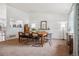 Dining room boasting natural light, a wooden table, and a view to the exterior at 12753 Buckhorn Creek St, Parker, CO 80134