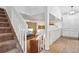 Staircase leading to a cozy living room area with nice furniture and natural light at 12753 Buckhorn Creek St, Parker, CO 80134