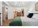 This main bedroom offers an ensuite bathroom and a walk-in closet for ample storage at 12753 Buckhorn Creek St, Parker, CO 80134