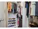 Well-organized walk-in closet with shelving for shoes and plenty of hanging space at 12753 Buckhorn Creek St, Parker, CO 80134