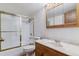 Bathroom features a shower-tub combo, wood cabinet, and a marble countertop at 13631 E Marina Dr # 608, Aurora, CO 80014
