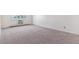 Bedroom featuring large carpeted area, a window and baseboard heater at 13631 E Marina Dr # 608, Aurora, CO 80014