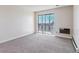 Bedroom showcasing sliding doors to a balcony and baseboard heating at 13631 E Marina Dr # 608, Aurora, CO 80014