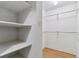 Interior of a closet with built-in shelving and hanging racks at 13631 E Marina Dr # 608, Aurora, CO 80014