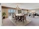 Elegant dining area with stylish decor and natural light, part of an open-concept living space at 13631 E Marina Dr # 608, Aurora, CO 80014