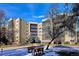 A spacious condo building with well-maintained landscaping and visible blue skies at 13631 E Marina Dr # 608, Aurora, CO 80014