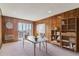 Office space featuring wood paneled walls and a walk-out balcony at 13631 E Marina Dr # 608, Aurora, CO 80014
