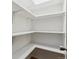 Well-organized pantry with ample shelving for efficient storage, painted in white at 13631 E Marina Dr # 608, Aurora, CO 80014