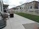 Well-maintained backyard with patio, artificial lawn, and white picket fence at 5223 Gray Wolf Ln, Castle Rock, CO 80104