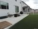Exterior view of backyard featuring a patio and artificial lawn at 5223 Gray Wolf Ln, Castle Rock, CO 80104