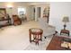 Open basement space with seating, rocking chair, and view into adjacent bathroom at 5223 Gray Wolf Ln, Castle Rock, CO 80104