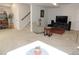 Finished basement featuring a large TV, and stairs leading to the main floor at 5223 Gray Wolf Ln, Castle Rock, CO 80104