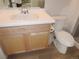 Bright bathroom with a white countertop and wood-paneled cabinet at 5223 Gray Wolf Ln, Castle Rock, CO 80104