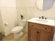 Modern bathroom featuring white wainscoting, updated fixtures, and a round mirror at 5223 Gray Wolf Ln, Castle Rock, CO 80104