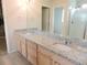 Bathroom boasting granite countertops, dual sinks, and ample lighting, combining style and functionality at 5223 Gray Wolf Ln, Castle Rock, CO 80104