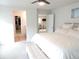 Bright bedroom featuring a ceiling fan, closet, and views into adjacent rooms, creating an open and connected living space at 5223 Gray Wolf Ln, Castle Rock, CO 80104