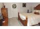 Bedroom featuring a large decorative bed, dresser and white door with wreath at 5223 Gray Wolf Ln, Castle Rock, CO 80104
