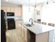 Modern kitchen with granite countertops, stainless steel appliances, and island with seating at 5223 Gray Wolf Ln, Castle Rock, CO 80104