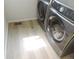 Laundry room featuring modern washer and dryer with bright natural light at 5223 Gray Wolf Ln, Castle Rock, CO 80104