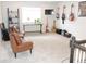 Spacious living room featuring leather chairs, mounted TV, and several guitars, great for entertaining at 5223 Gray Wolf Ln, Castle Rock, CO 80104