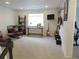 Spacious living room featuring leather chairs, mounted TV, and several guitars, great for entertaining at 5223 Gray Wolf Ln, Castle Rock, CO 80104