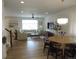 Bright, open living room with hardwood floors, modern lighting, and stylish furniture arrangement at 5223 Gray Wolf Ln, Castle Rock, CO 80104