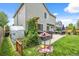 Landscaped backyard featuring a patio, hot tub, greenhouse, and a fun disc golf target at 11188 Latigo Ln, Parker, CO 80138