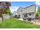 View of backyard with patio, hot tub, shed, green lawn, and privacy fence at 11188 Latigo Ln, Parker, CO 80138