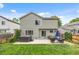 Well-maintained backyard with a luxurious hot tub, comfortable seating, and lush green lawn at 11188 Latigo Ln, Parker, CO 80138