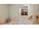 Inviting basement area leading to a cozy living room with wood-accent wall and plush seating at 11188 Latigo Ln, Parker, CO 80138