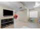 Finished basement features a comfortable seating area, entertainment center, and adjacent playroom at 11188 Latigo Ln, Parker, CO 80138
