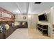 Basement living room features a cozy sectional sofa, wood-accent wall, and entertainment center at 11188 Latigo Ln, Parker, CO 80138