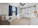 Cozy bedroom with plush carpet, ceiling fan, and chair, perfect for a Bedroom or small room at 11188 Latigo Ln, Parker, CO 80138
