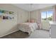Comfortable bedroom featuring a whimsical four-poster bed, soft carpet and bright natural light at 11188 Latigo Ln, Parker, CO 80138