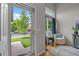 Bright entryway with hardwood floors, a decorative window, and a view of the landscaped front yard at 11188 Latigo Ln, Parker, CO 80138